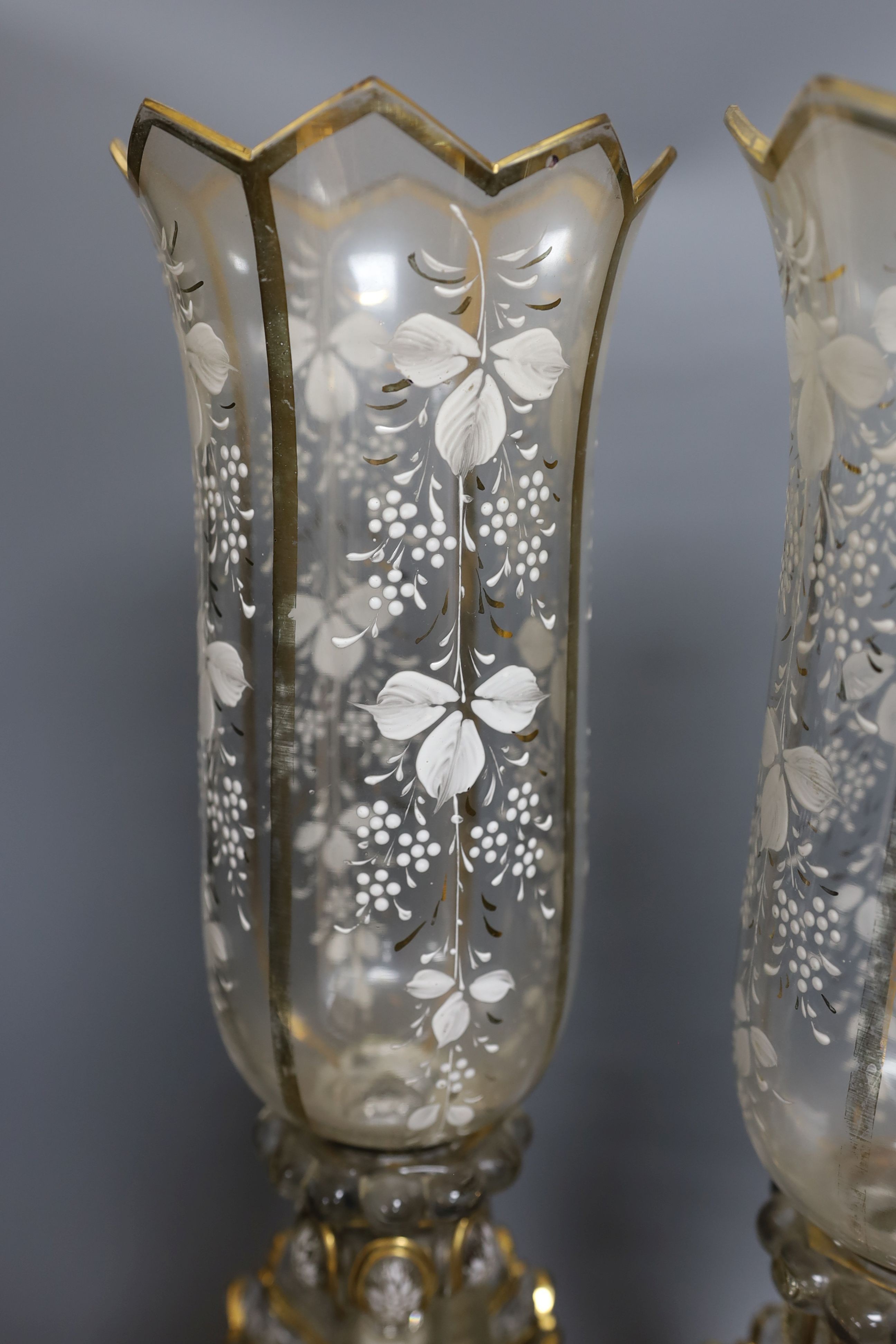 A pair of late 19th century French white-enamelled glass lustre hung storm lamps, 55cms high.